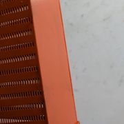Vintage metal magazine rack in perforated orange/Mathieu Mategot style/70s