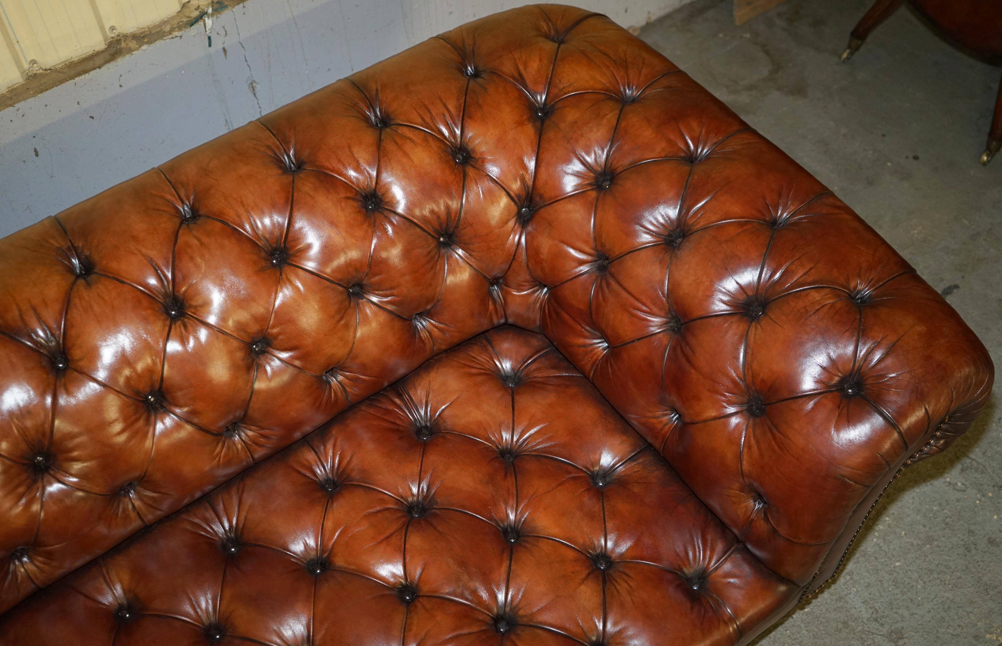 Pair of Early Victorian leather Chesterfield sofas by George Smith.