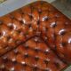 Pair of Early Victorian leather Chesterfield sofas by George Smith.