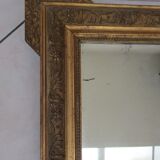 Mirror with gilded wood and stucco frame, early 20th century, 59x83cm