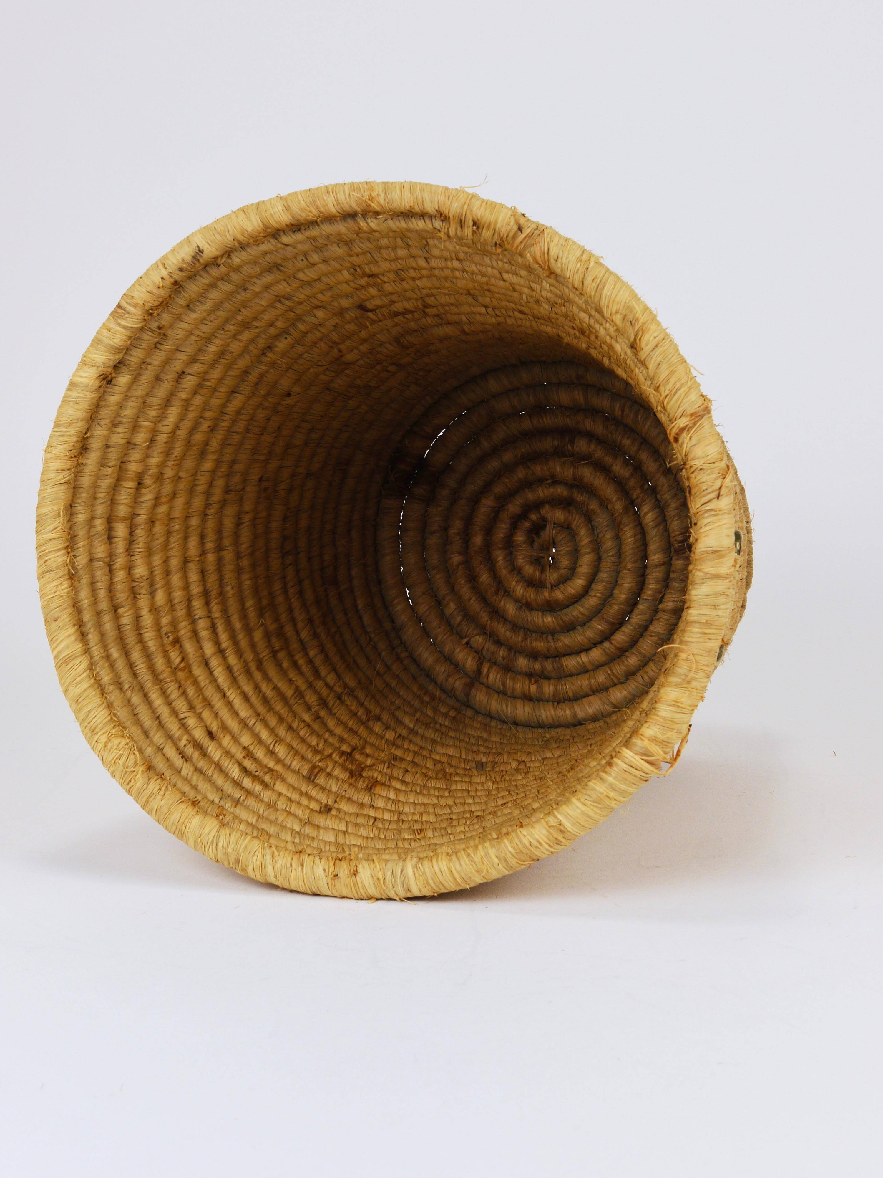 Carl Auböck II paper basket in raffia and brass, umbrella stand, 1950s