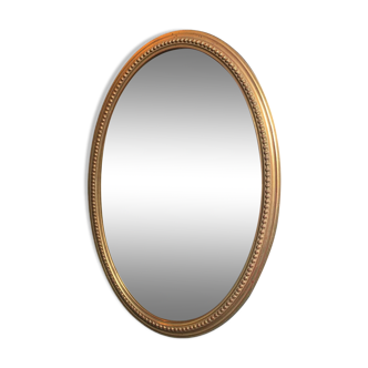 Vintage beveled gold oval mirror