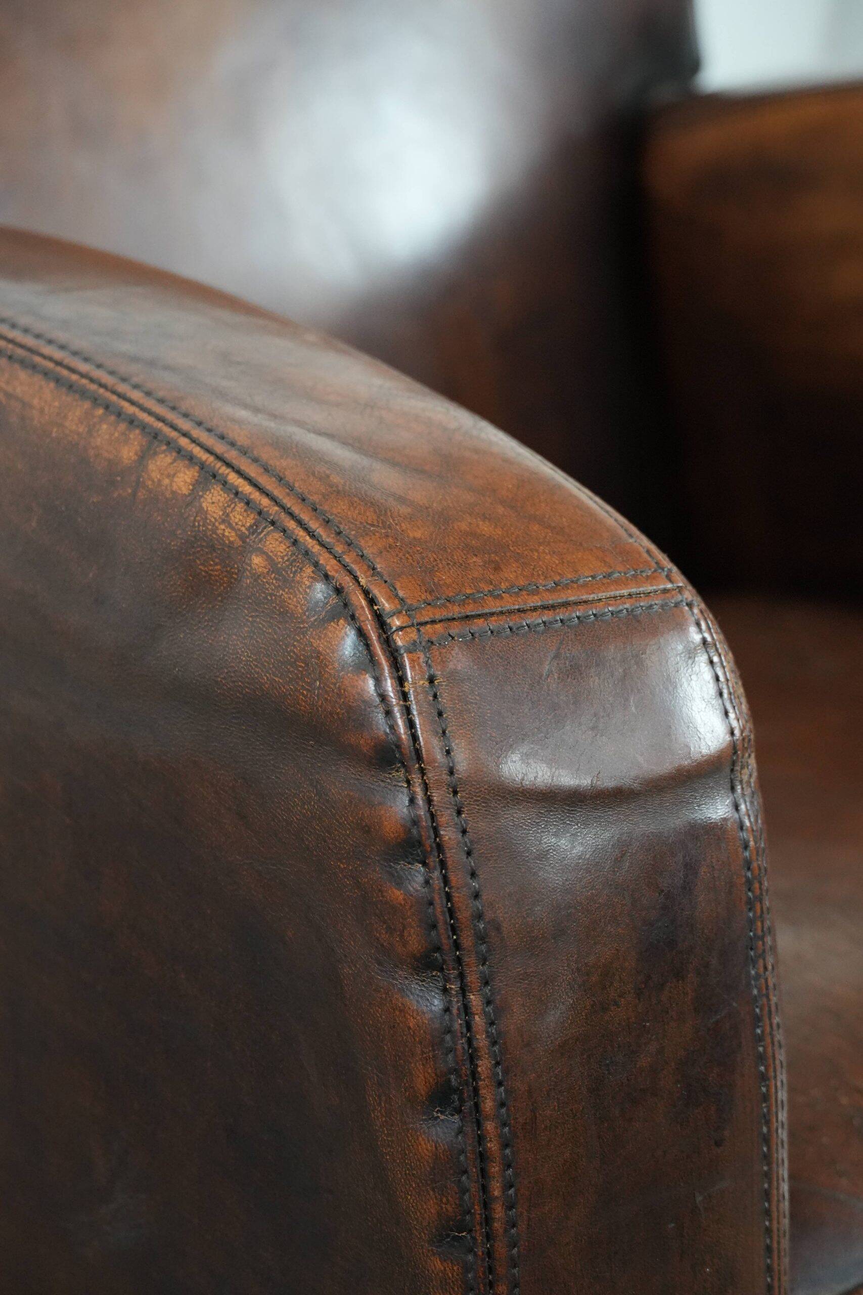 Beautifully shaped vintage sheepskin armchair with character