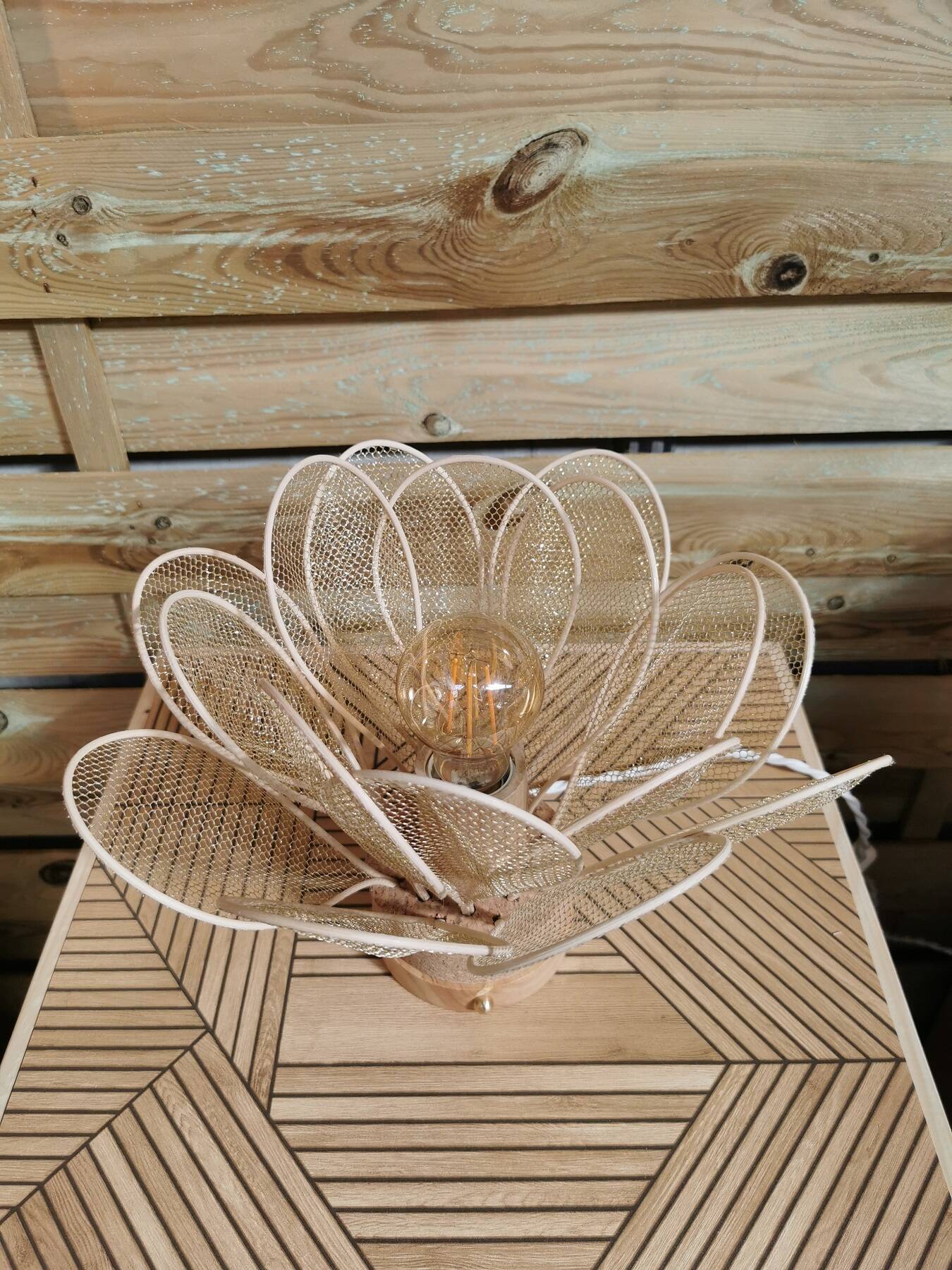 Flower table lamp made of rattan petals and gold mesh