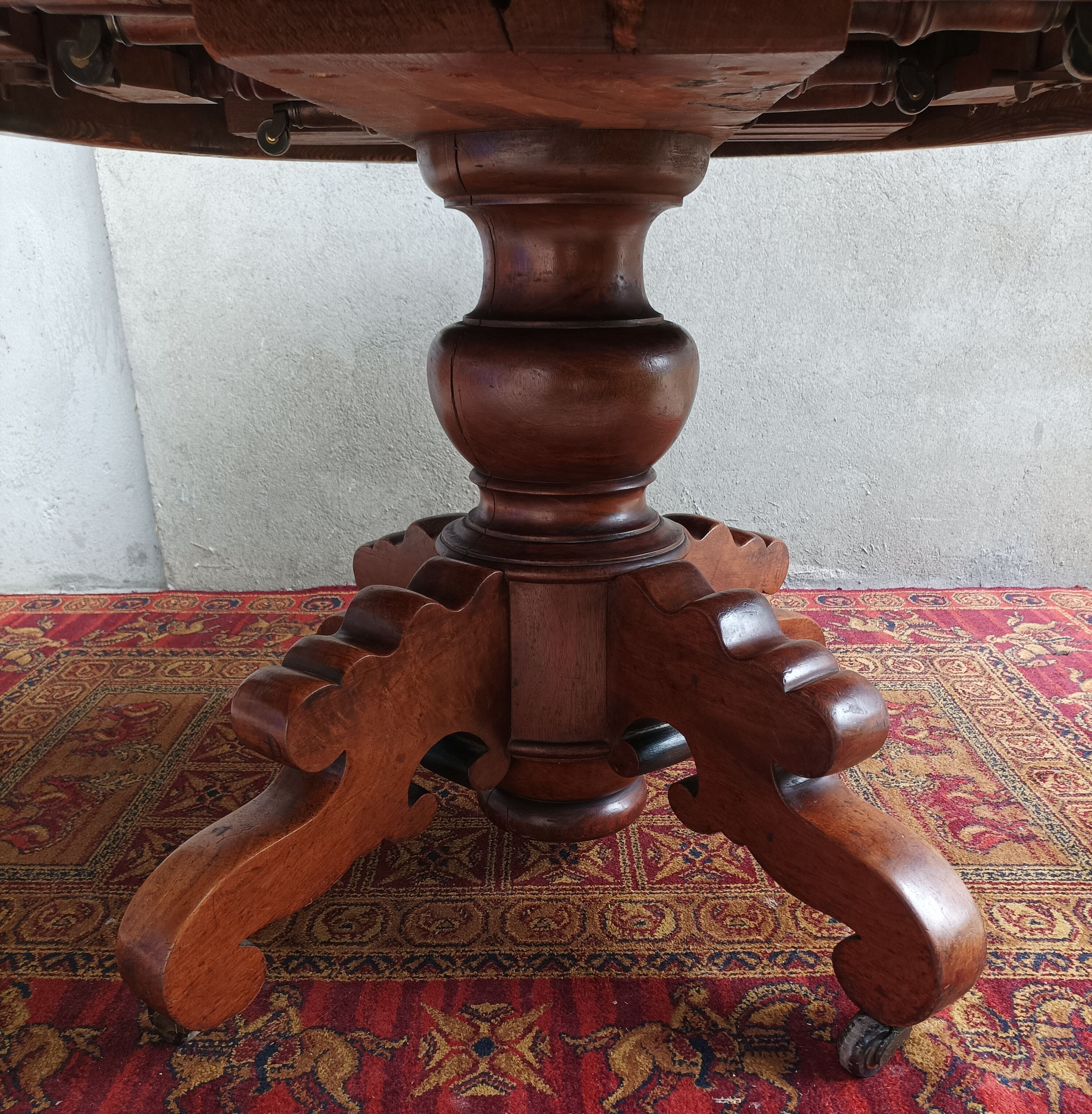 English oval table with 19th century mahogany extensions
