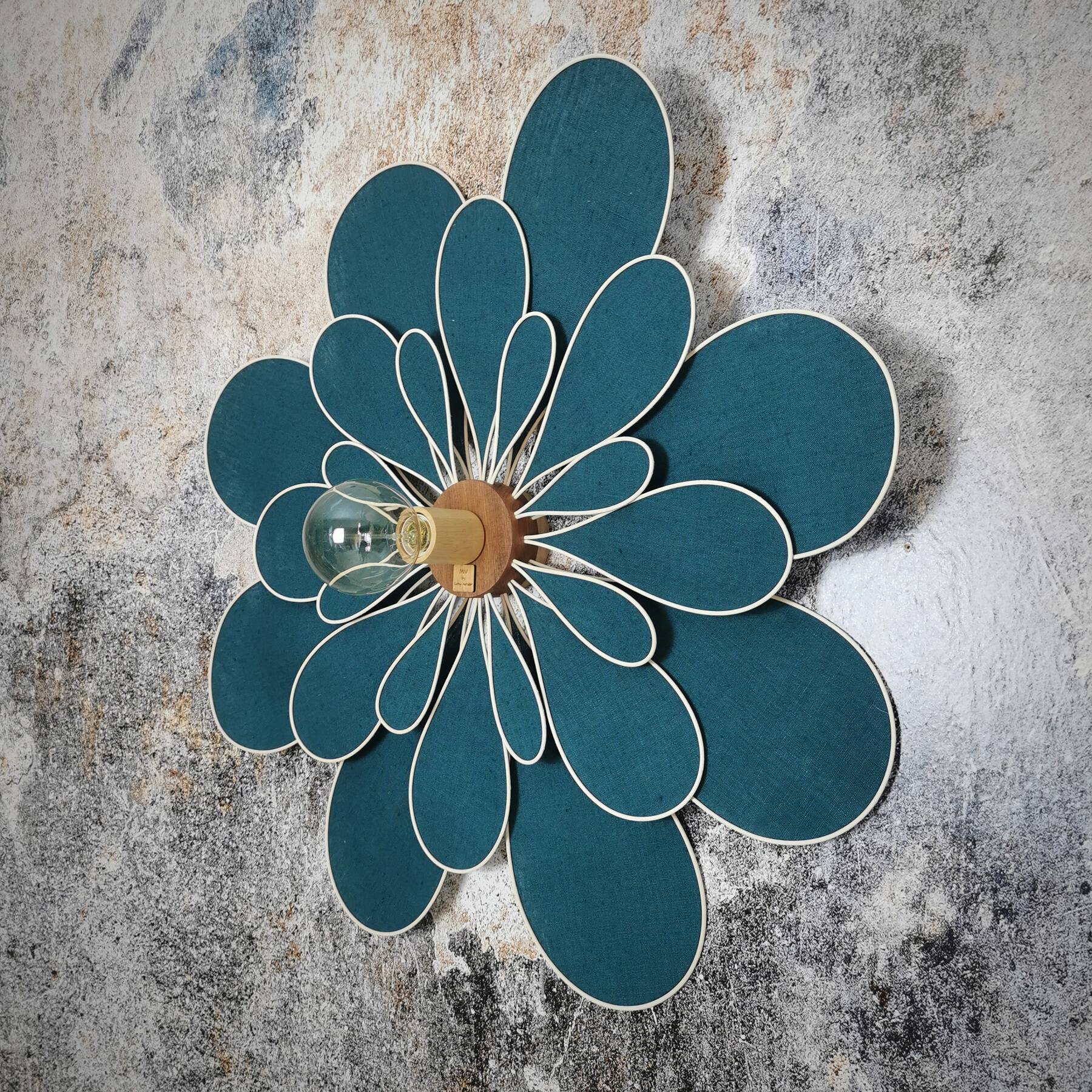 Peacock blue rattan and linen 24 petal flower wall light