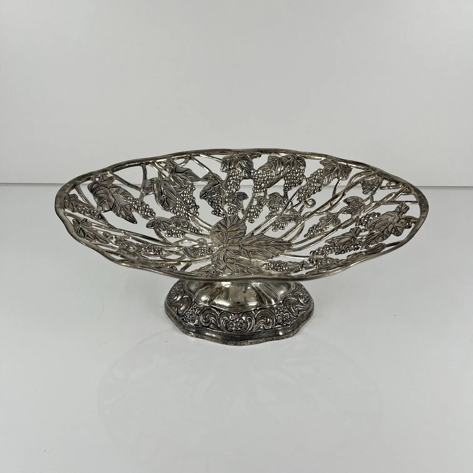 Openwork metal bowl with vine leaf and grape motif, 20th century
