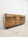 Mid-century hardwood office buffet with bar, drawers, and shelf.