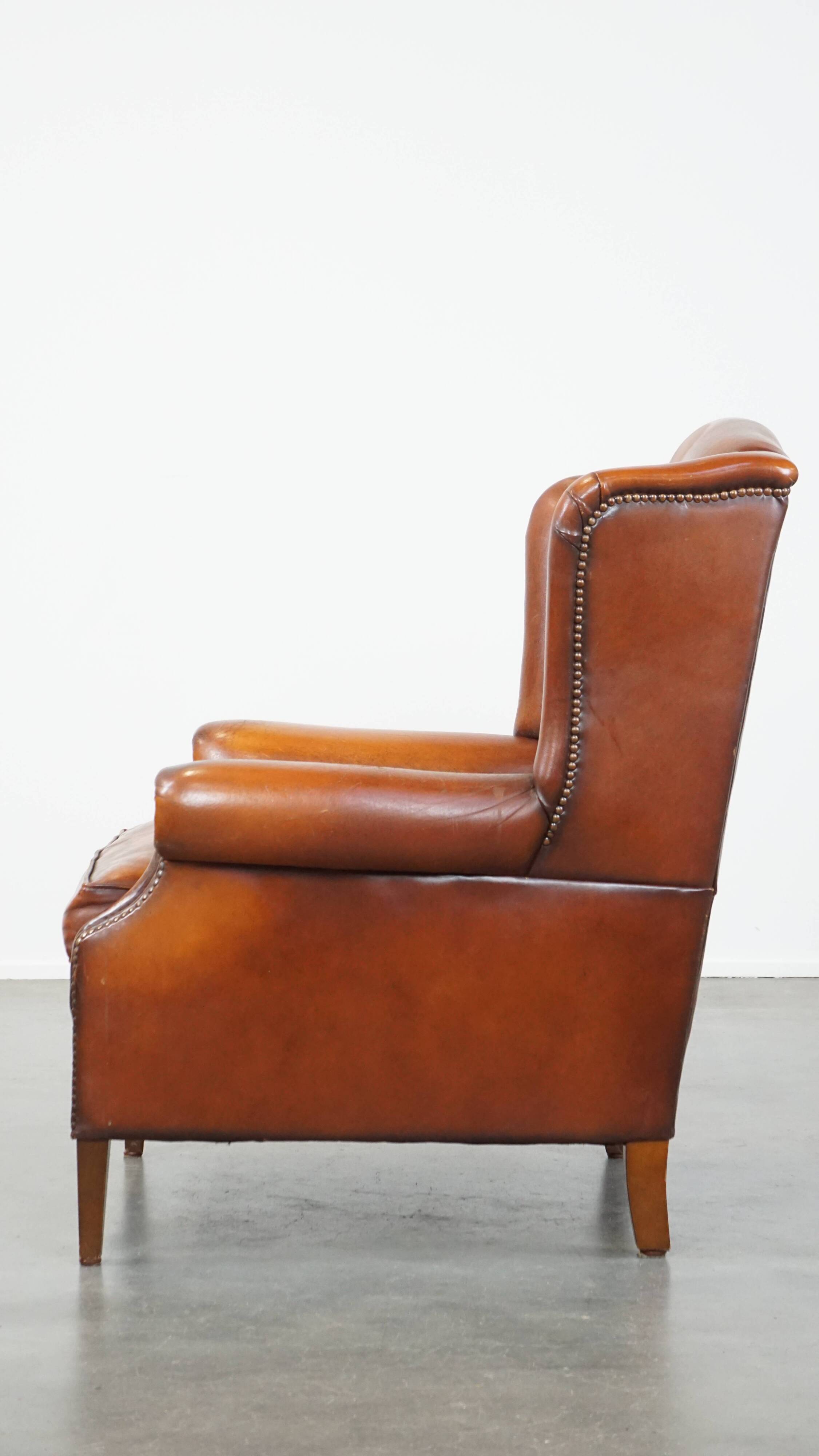 Sheepskin leather wingback chair with patina