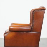 Sheepskin leather wingback chair with patina
