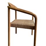 Solid wood chair with woven seat and armrests