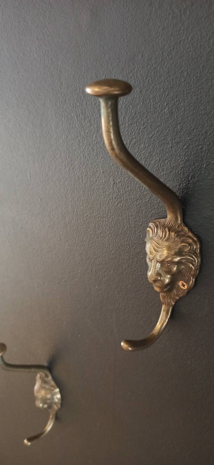 Set of 5 antique "Lion Head" coat hooks.