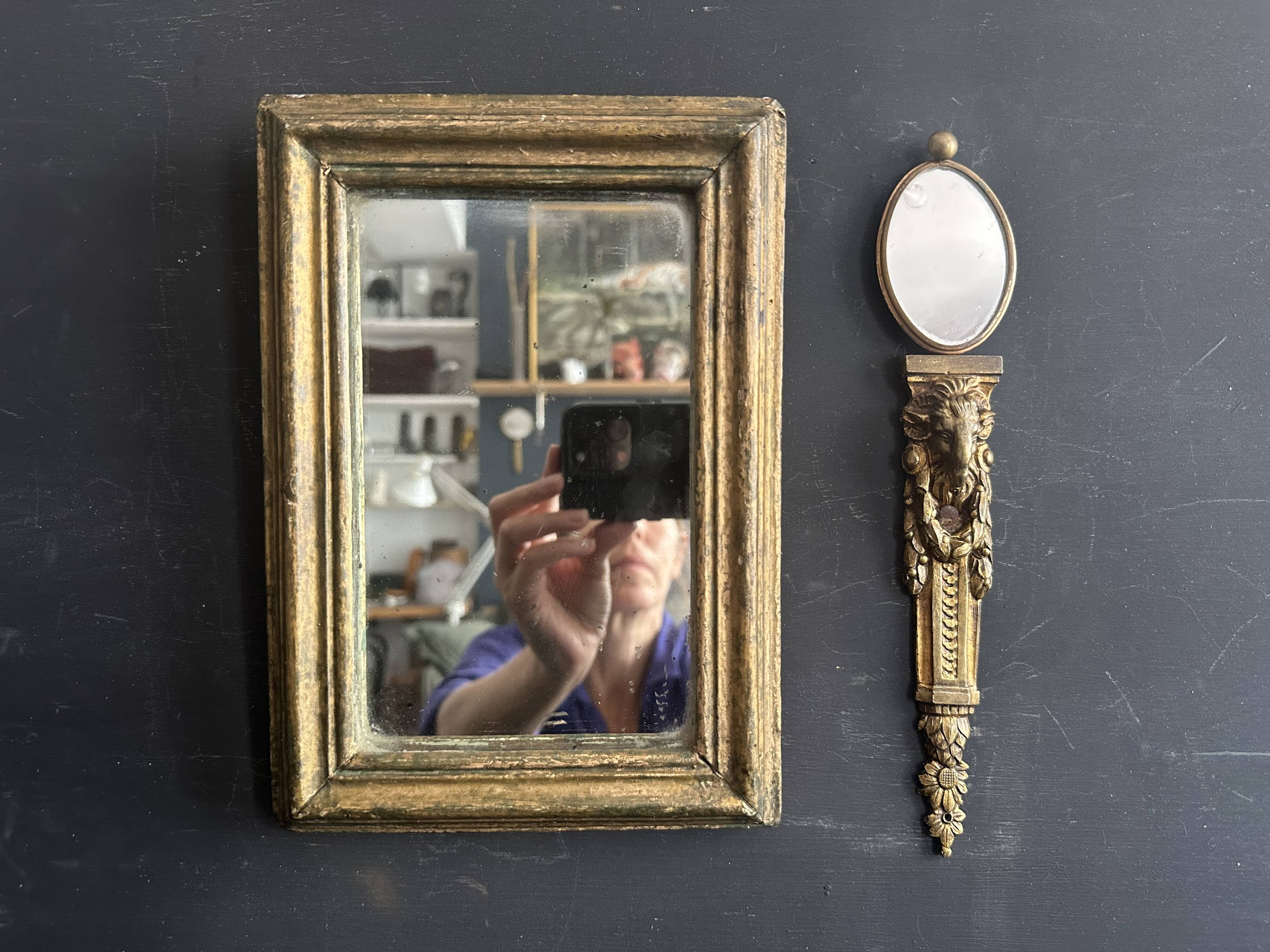 Miniature mirror from the 18th century in gilded wood, mercury glass.