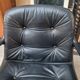 Pair of Comforto armchairs in black leather. Vintage 70s.