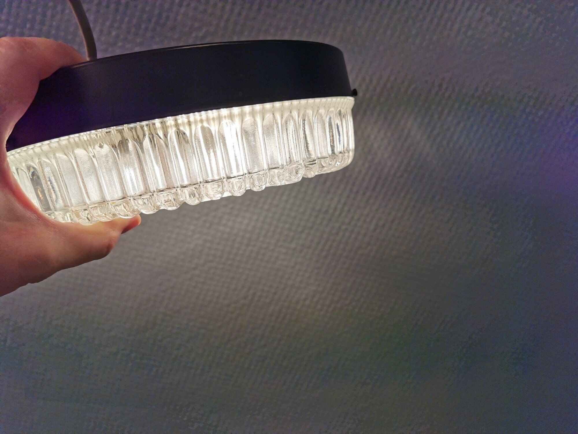 Ceiling light, in dark metallic paint with thick glass shade with beautiful details in the glass.