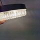 Ceiling light, in dark metallic paint with thick glass shade with beautiful details in the glass.
