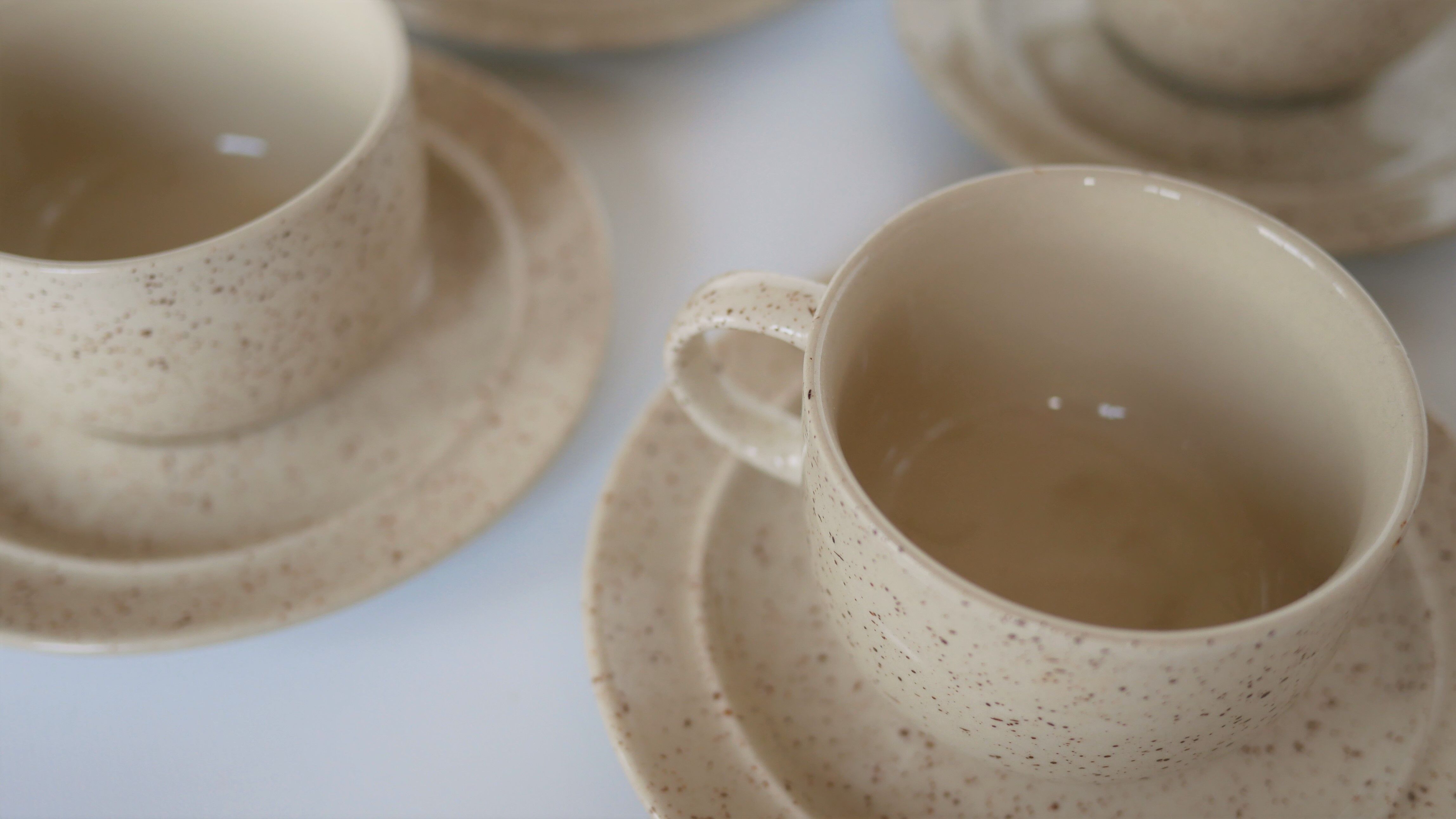 Coffee cup and vintage pyrity sandstone subcup