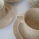 Coffee cup and vintage pyrity sandstone subcup