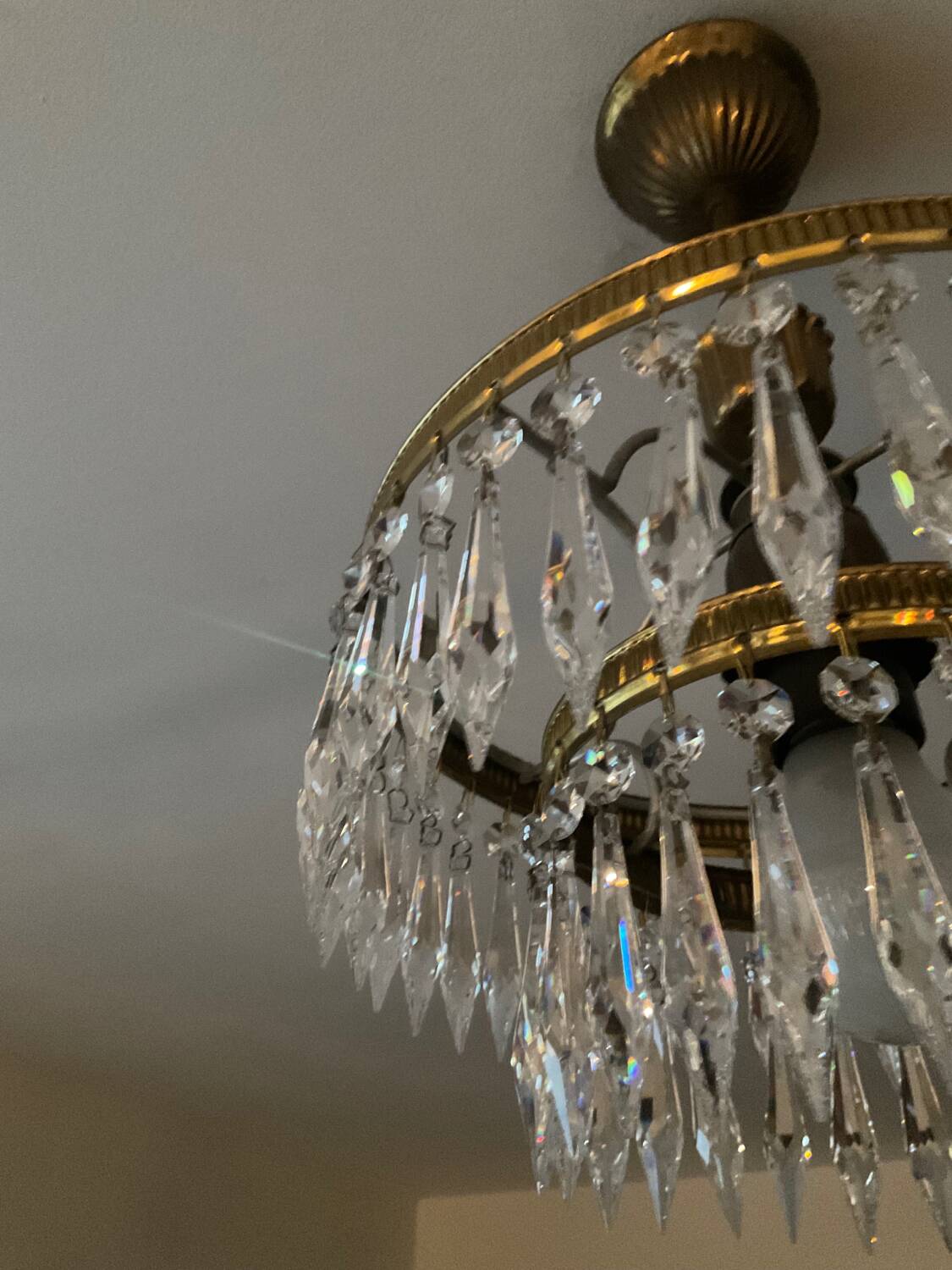 Cascade chandelier with crystal and brass tassels