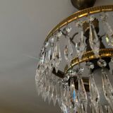 Cascade chandelier with crystal and brass tassels