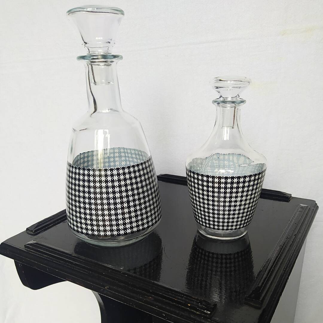 Set of 2 black and white houndstooth glass carafes from the Arques crystal factory. Rare.