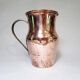 Old pitcher made of tinned copper
