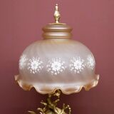 Table lamp with a tall base.