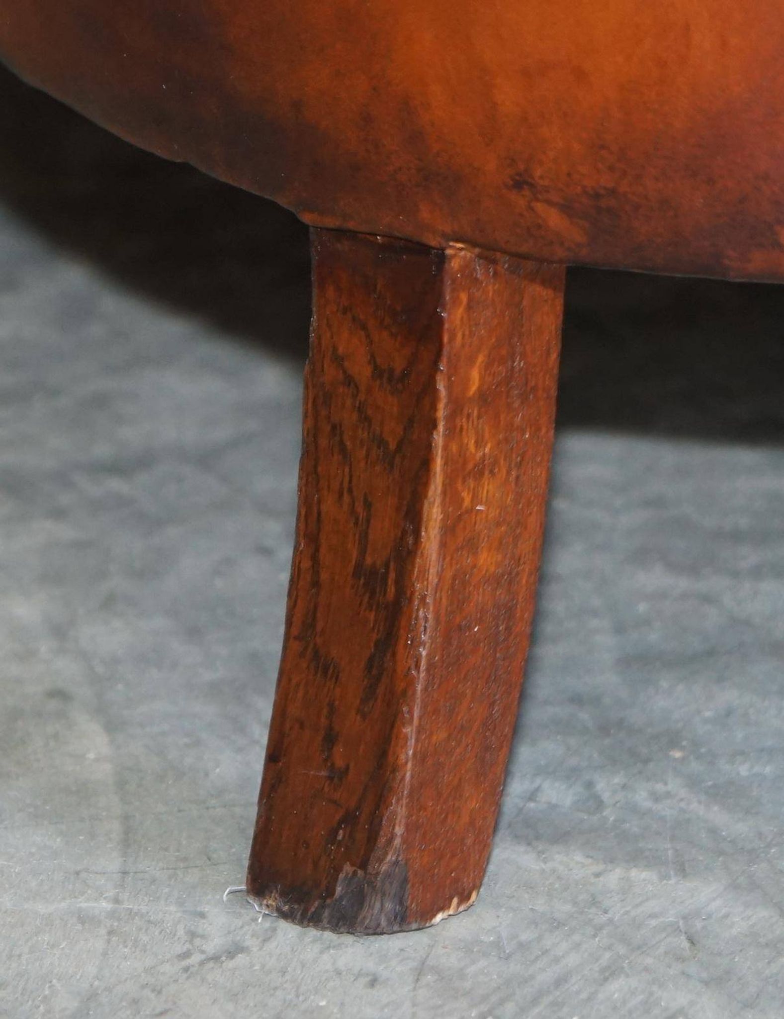 Victorian Chesterfield leather canapé with oak lion claw feet.