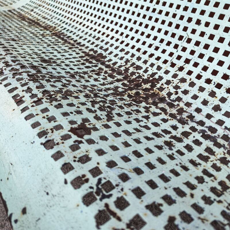 Public bench made of perforated iron