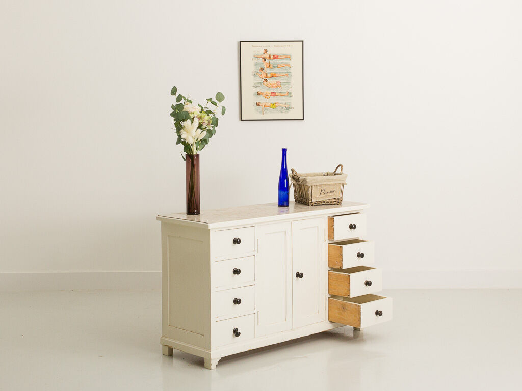 Small accent cabinet with drawers and swing doors