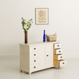 Small accent cabinet with drawers and swing doors