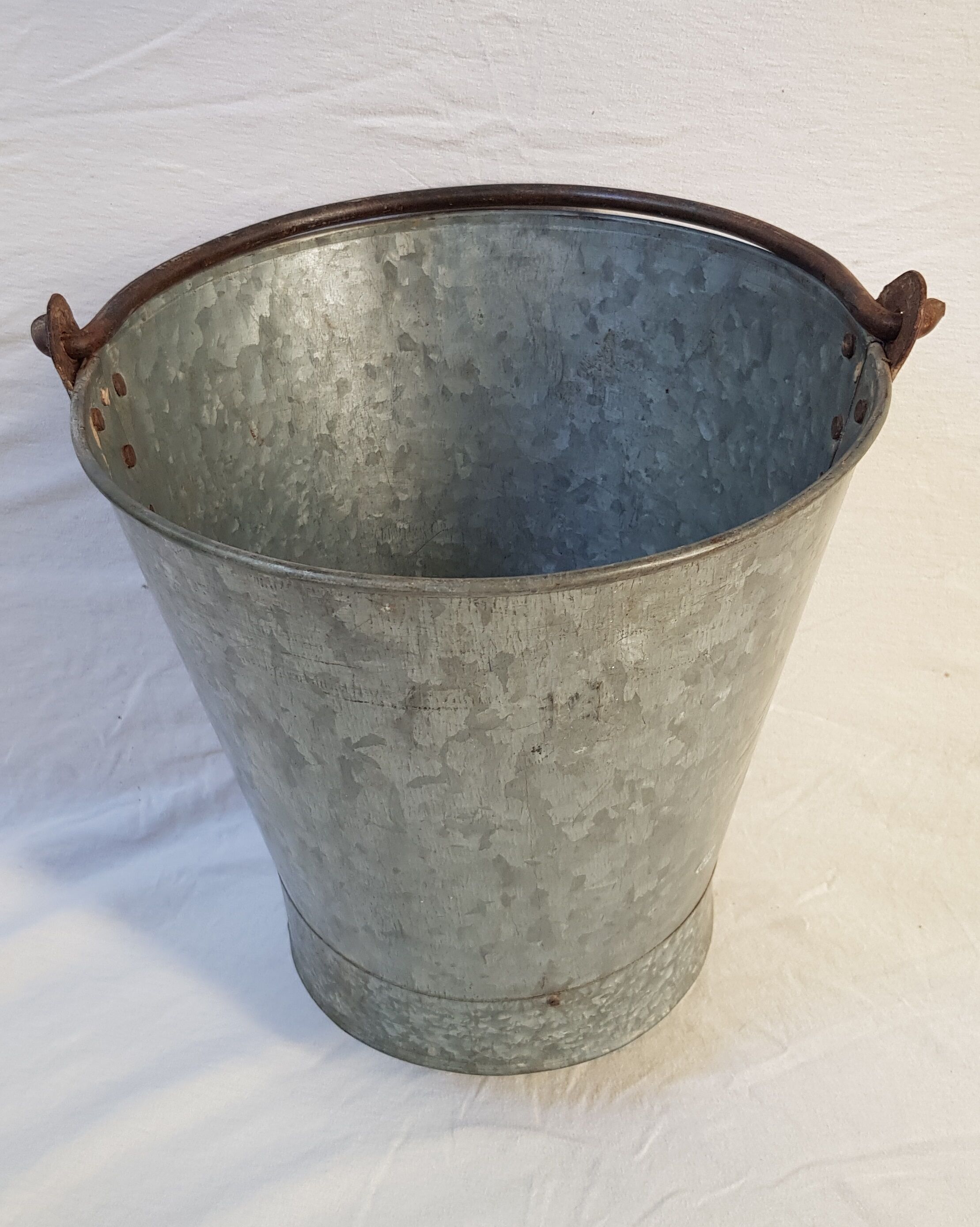Old bucket with thick zinc handle