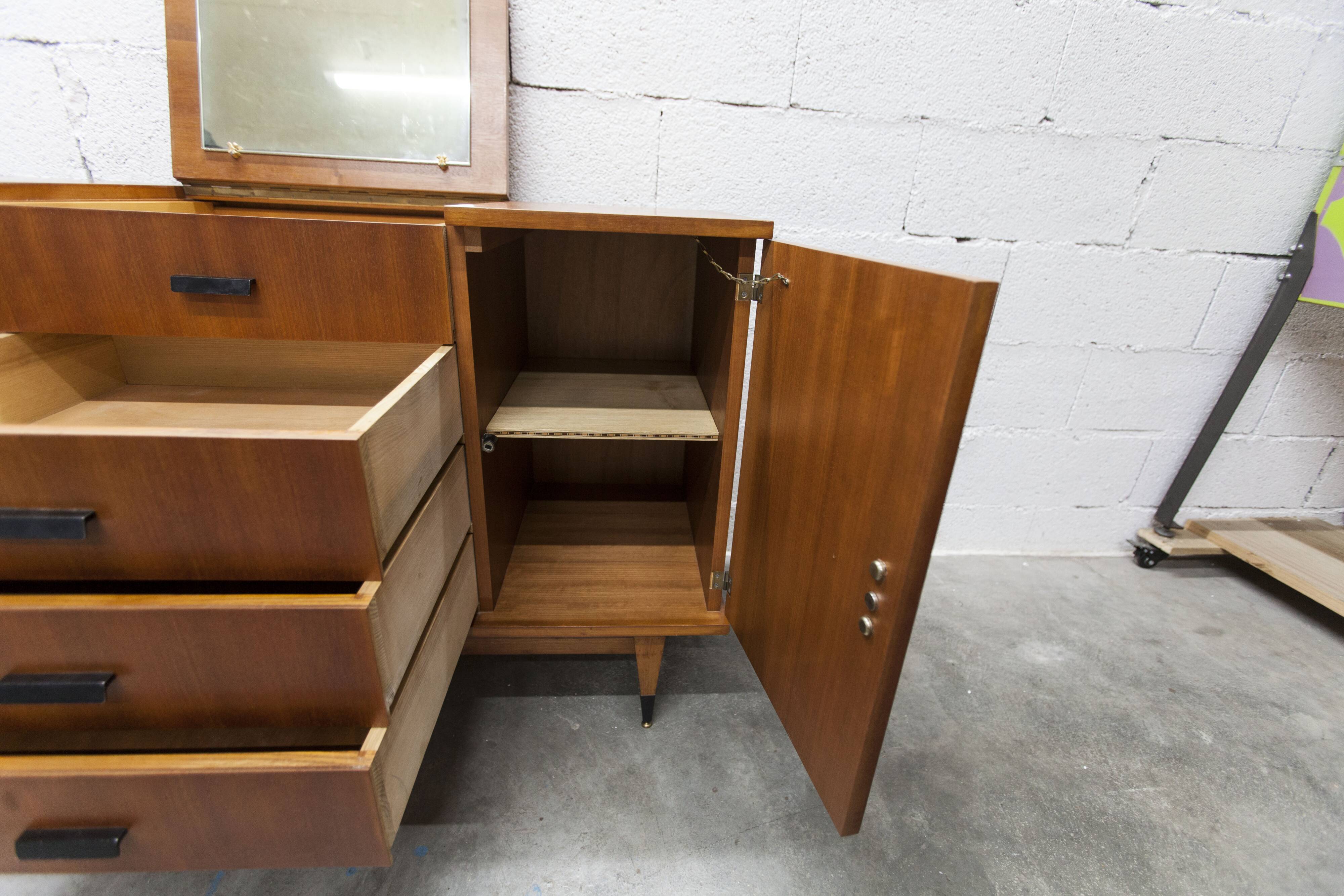 1960s teak sideboard with 4 drawers, 2 doors, and a mirror.