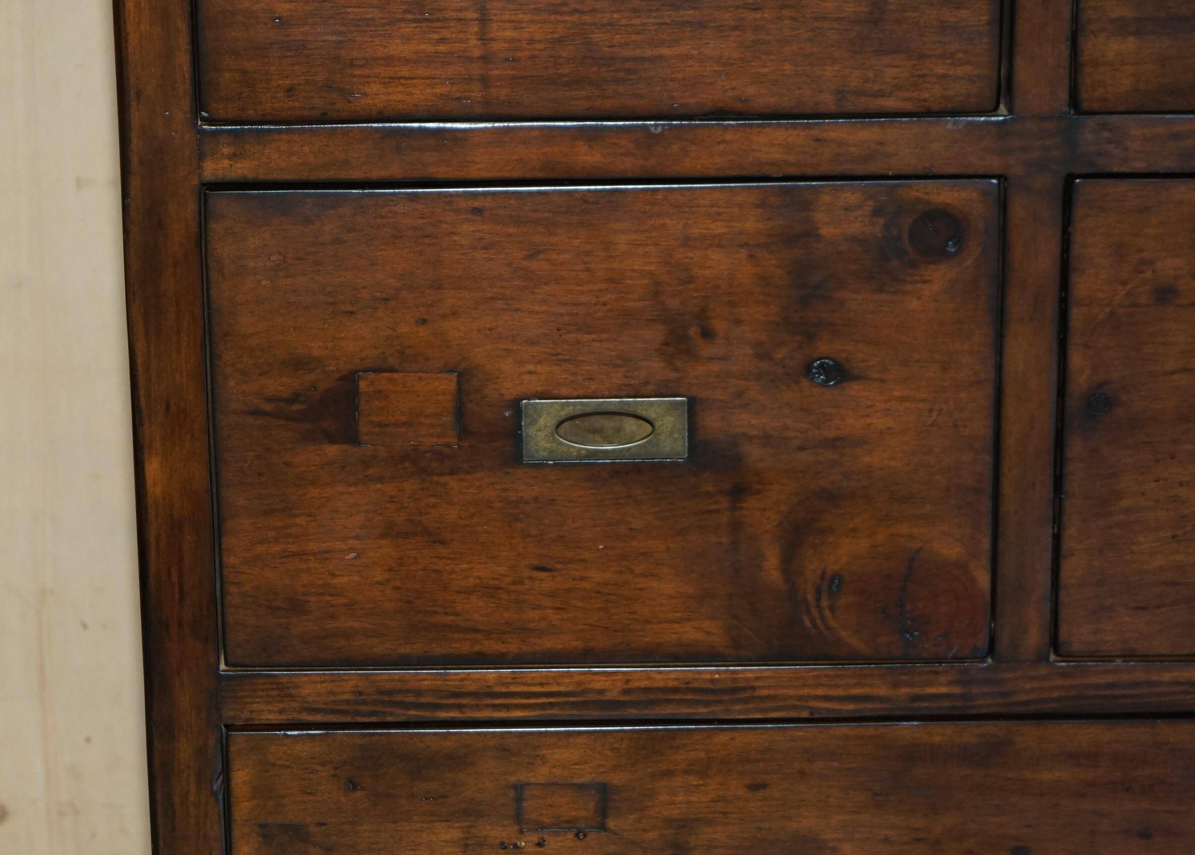 Large vintage hardwood furniture in military country style.