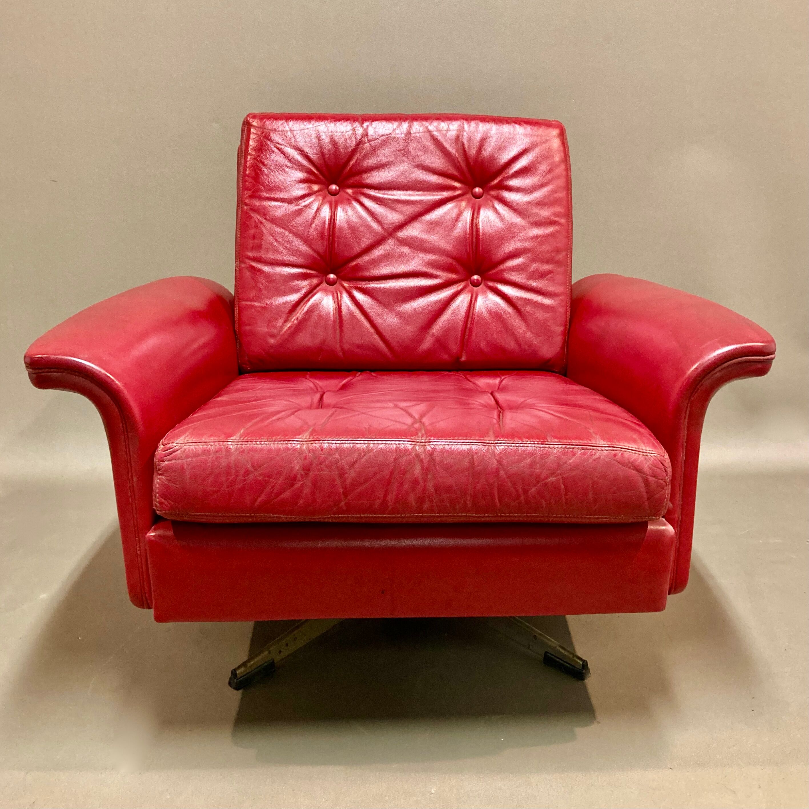 Red leather armchair design 1950