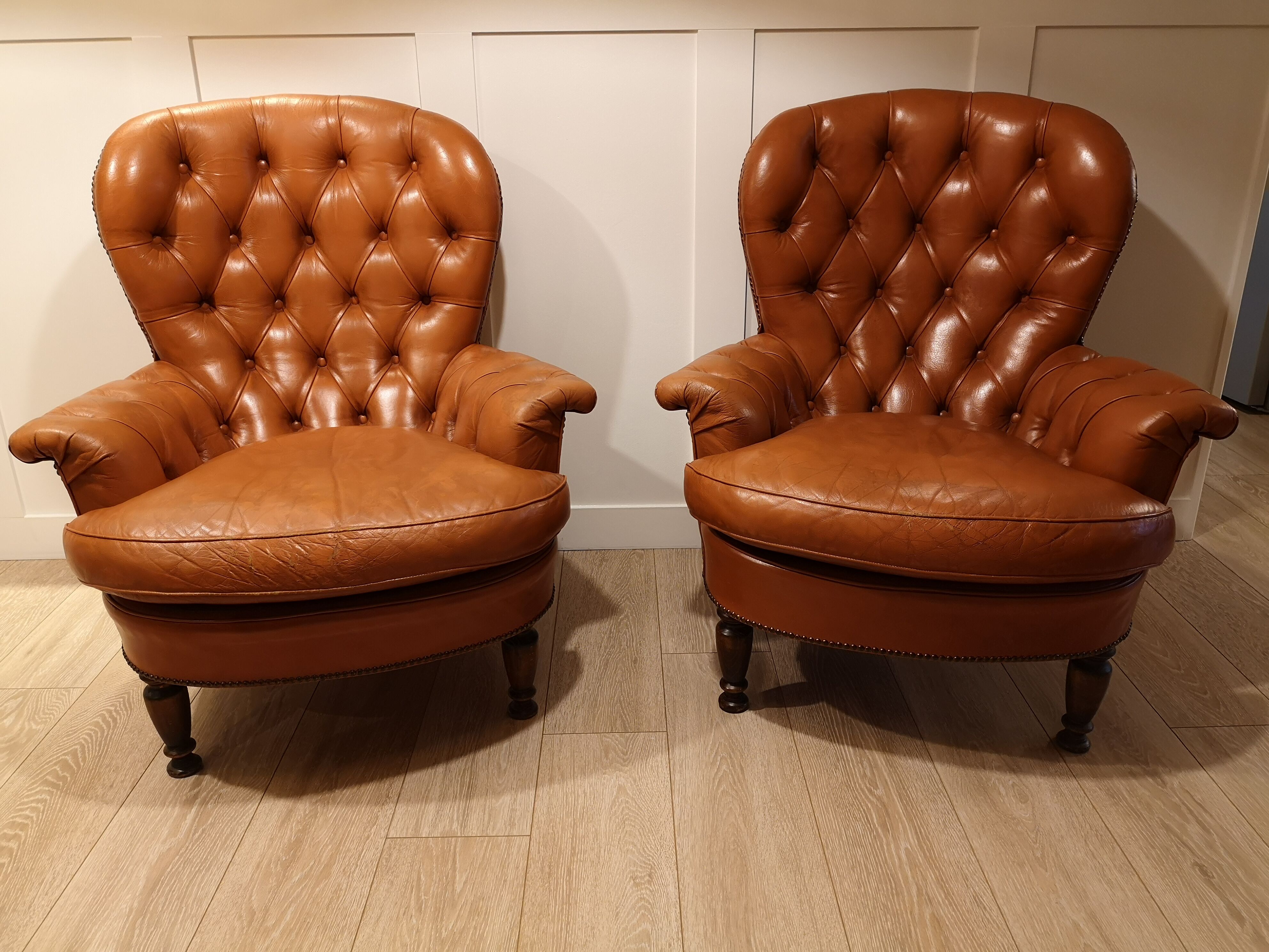 Pair of leather chesterfield chairs