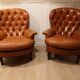 Pair of leather chesterfield chairs