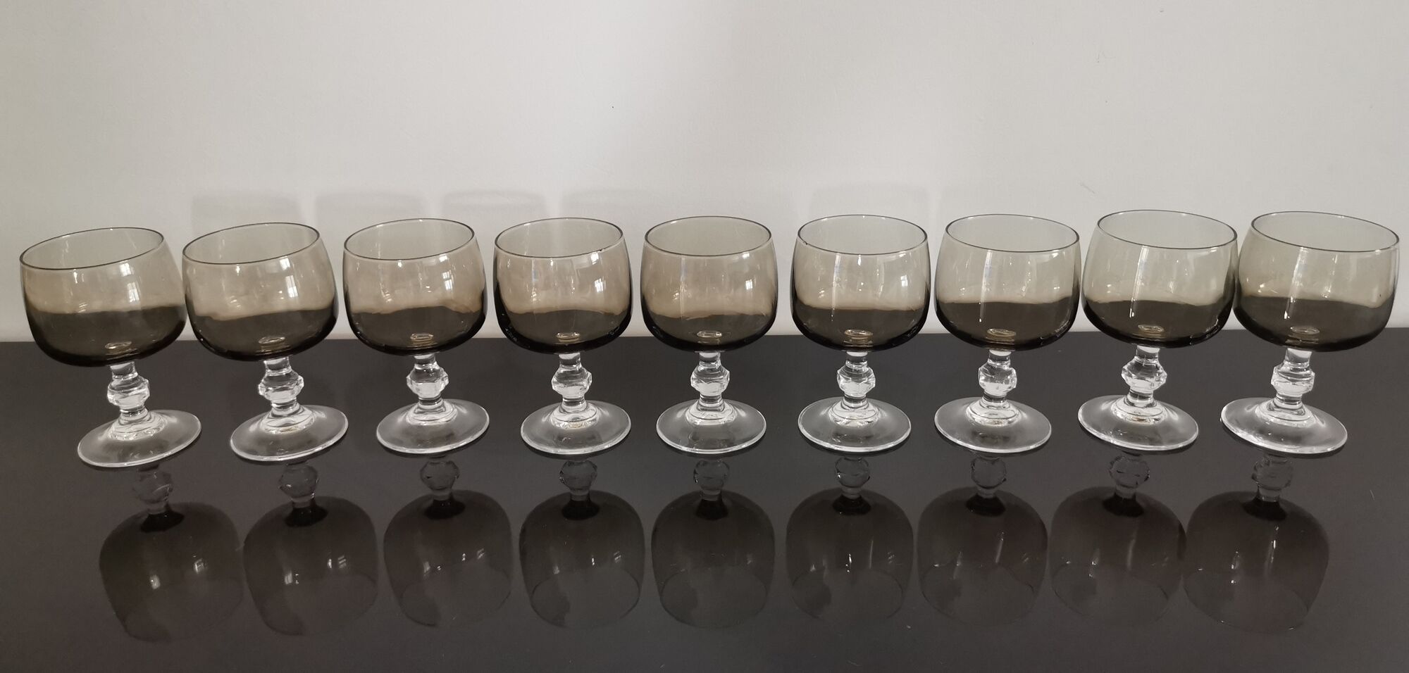 9 glasses of white wine on vintage stand Luminarc Smoked Black