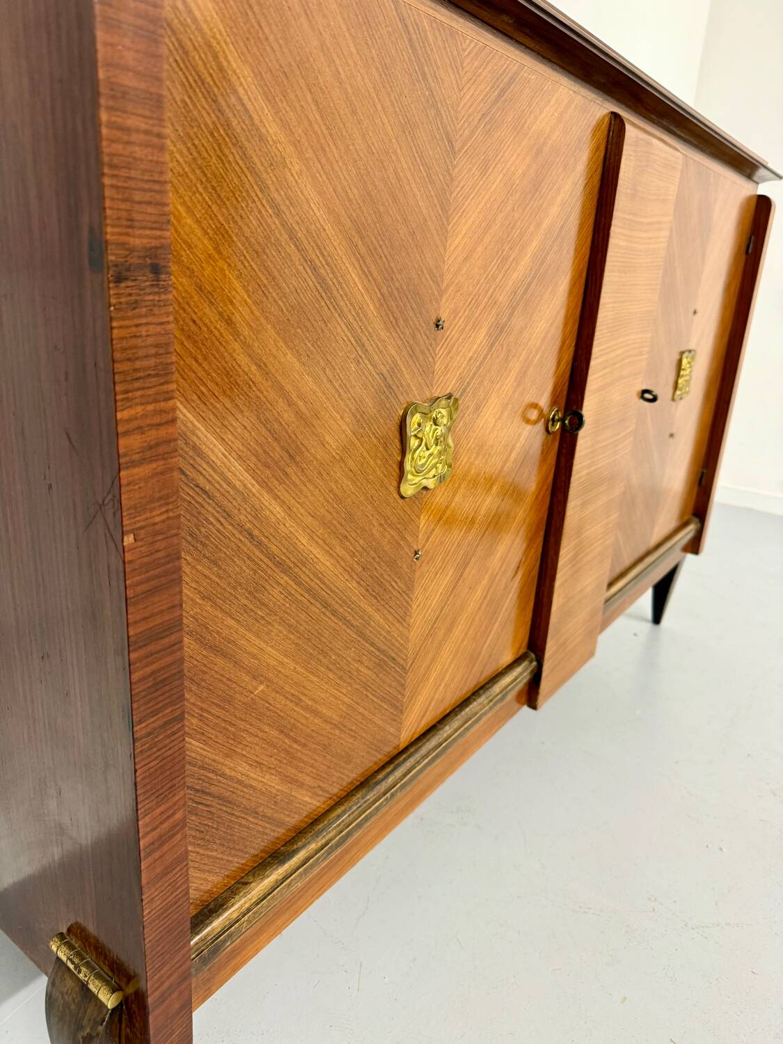 Antique art deco sideboard from the 1930s with veneered wood and bronze insert