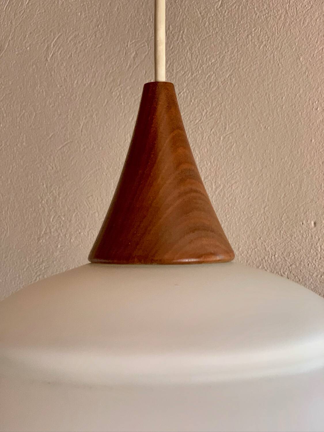 Scandinavian teak and opaline pendant light by Louis Kalff for Philips in 1968