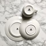 Teacup on its saucer and porcelain cake plate