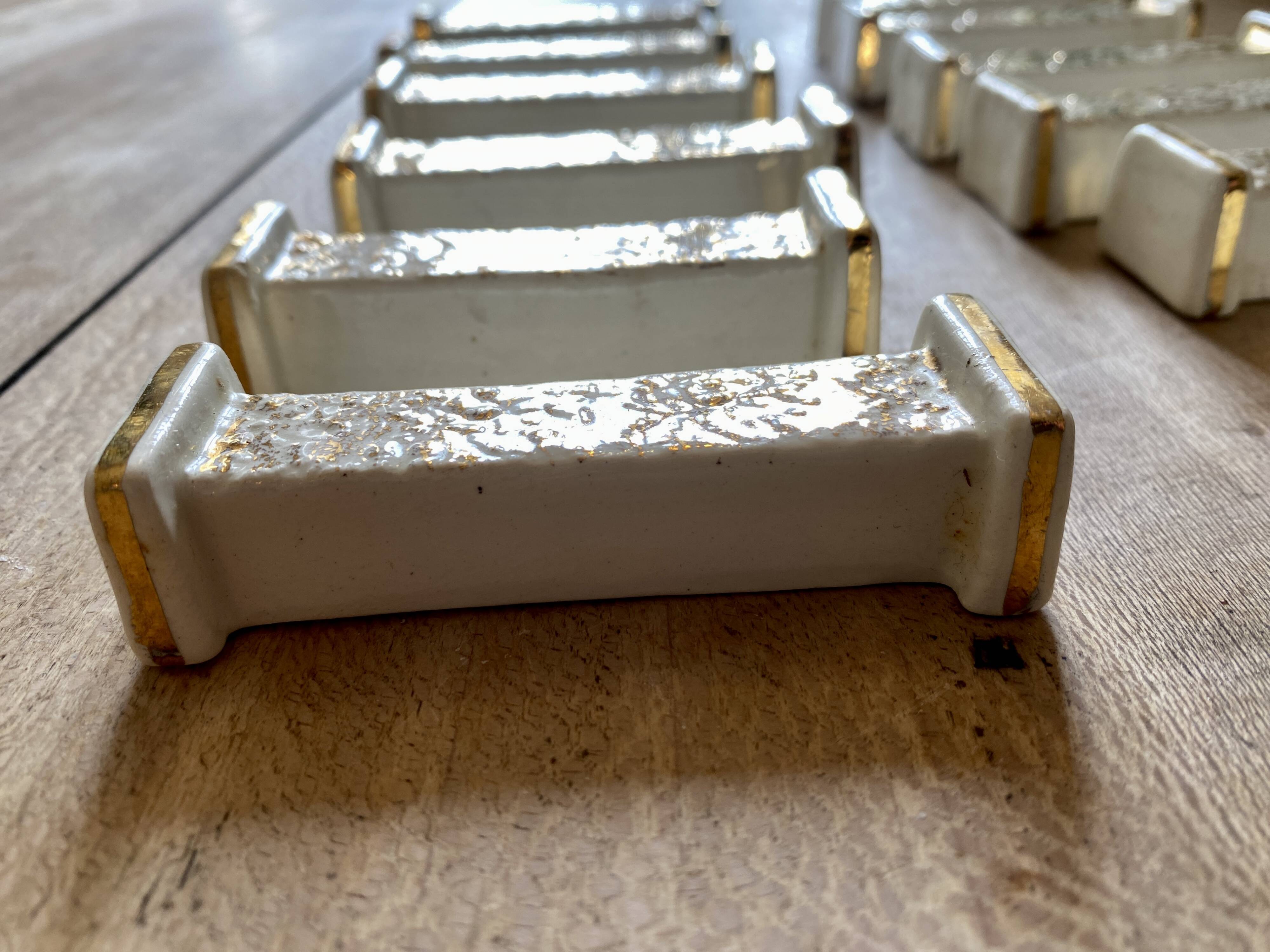 Set of 10 vintage art deco knife holders in white and gold ceramic