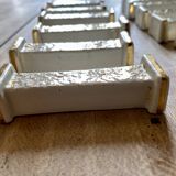 Set of 10 vintage art deco knife holders in white and gold ceramic