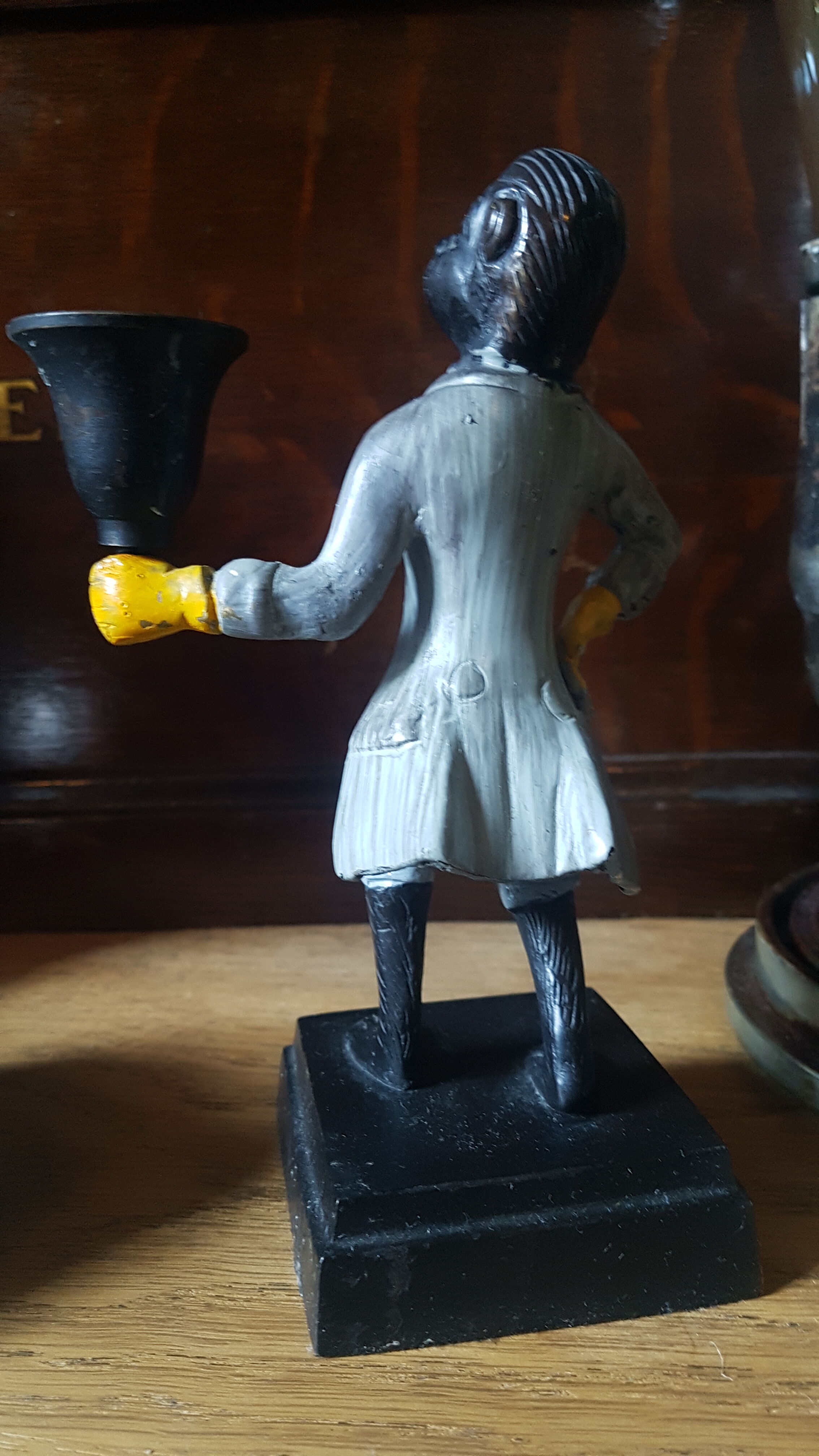 Cast iron servant monkey candle holder