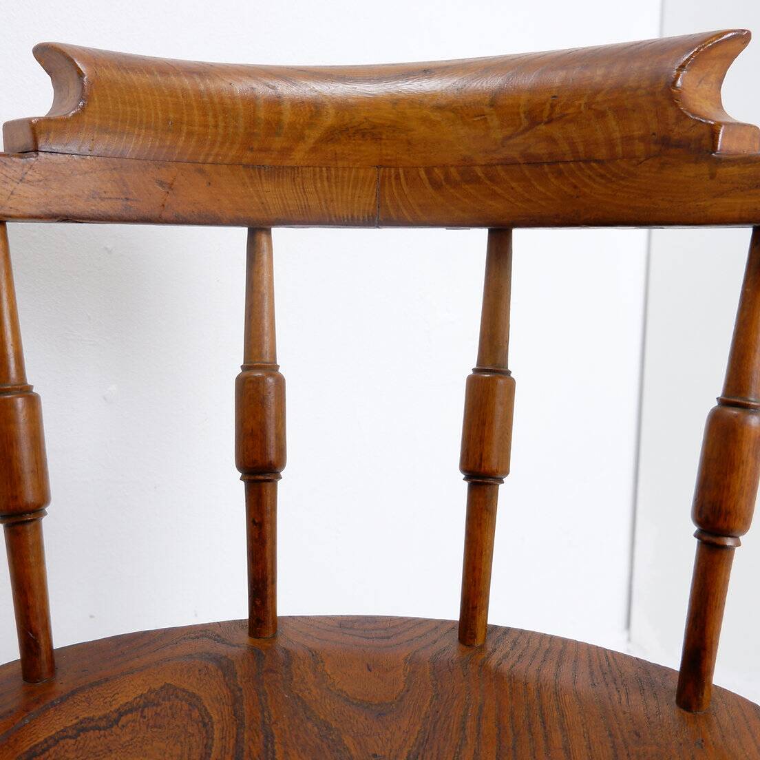 Elm armchair with curved back