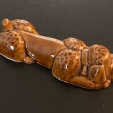 10 ceramic knife holders in the shape of a recumbent poodle