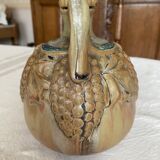 Wine pitcher in stoneware motifs grapes in relief signed Denbac