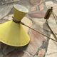 Diabolo wall lamp lunel yellow in the style of René Mathieu Guariche, star sheet metal.