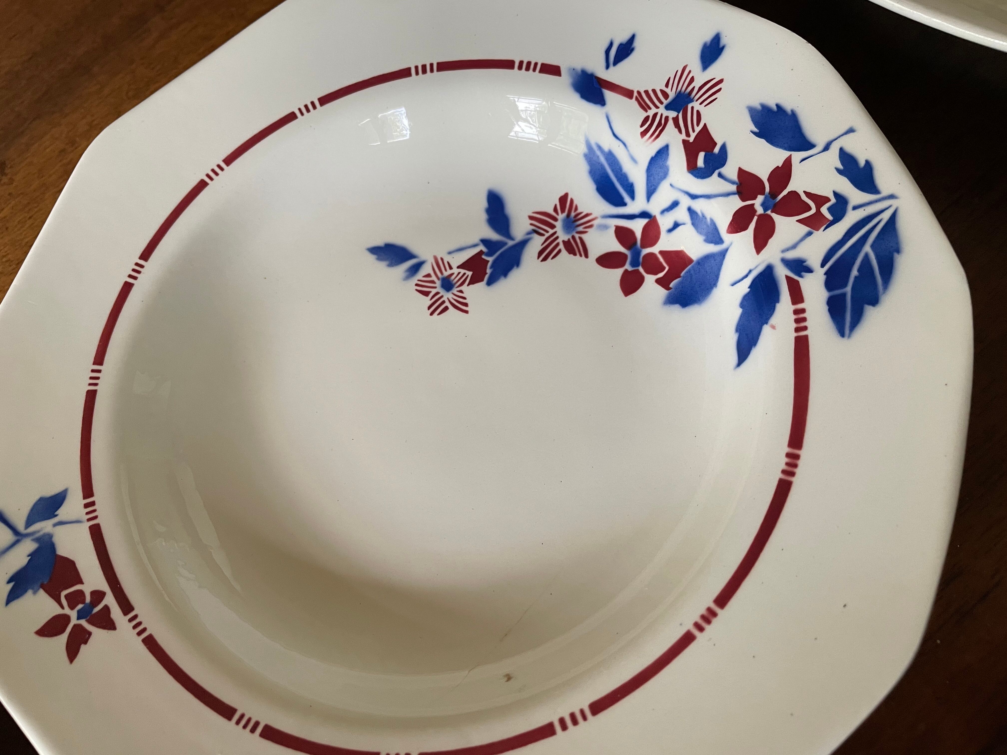 Saint Amand hollow plates decorated with red and blue flowers