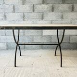 Table made of wrought iron and cement